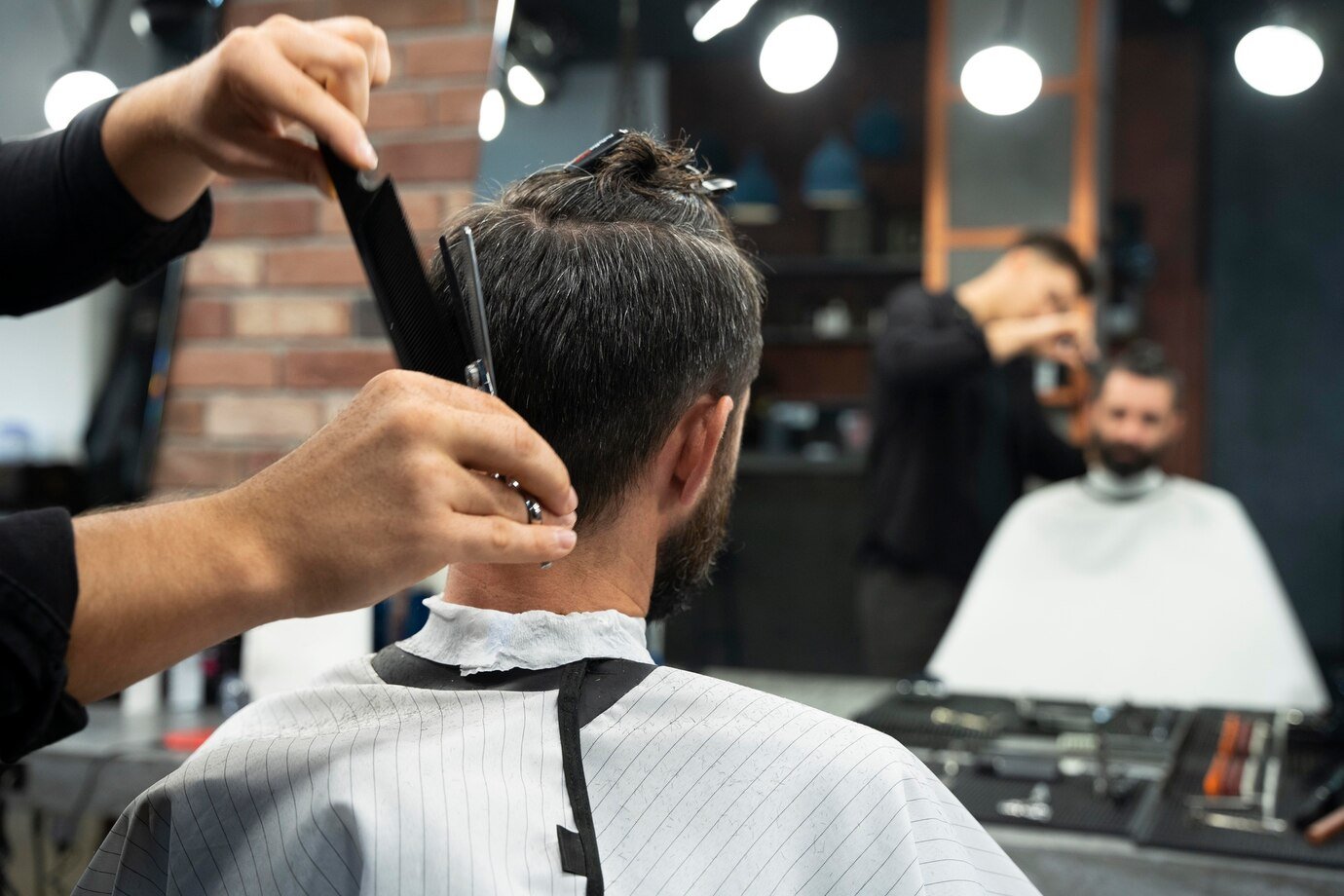 Close-up of a man receiving a precise haircut from a skilled barber in Vaughan, highlighting expert craftsmanship and attention to detail.